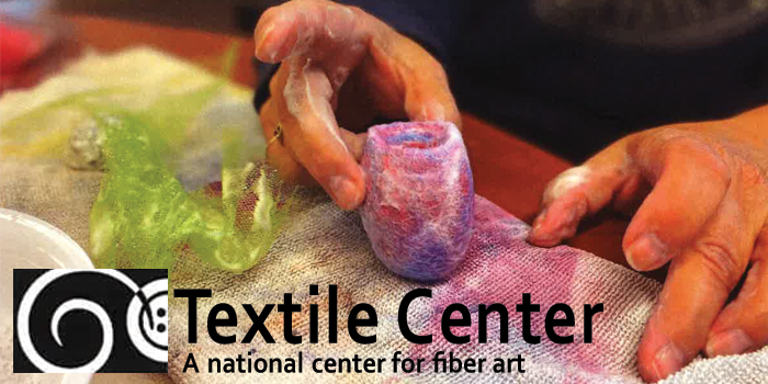 Textile Center logo and colorful paint image