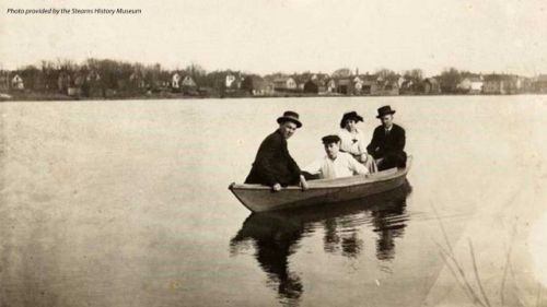 Stearns History Museum image of four people in canoe on water