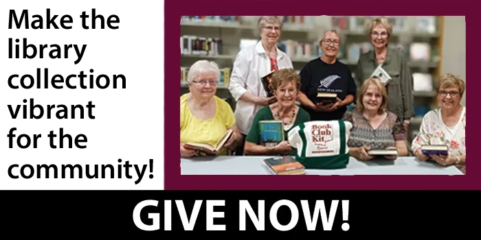 book club group holding their books and beside a book club kit