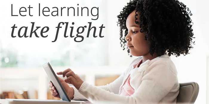 Text: Let learning take flight; Image: girl reading on device
